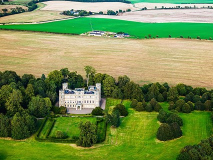 Wedderburn Castle and Barns over fields from a drone, Duns, Berwickshire, Scotland, UK