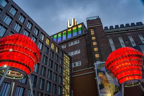 Illuminated sculptures of Dortmund roses in front of Dortmund's landmark U, Centre for Art and