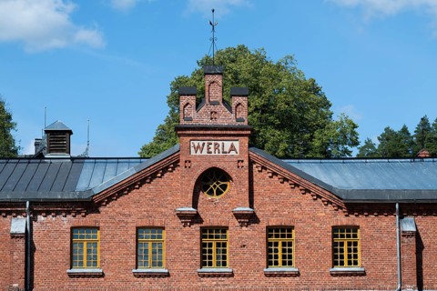 Brick façade with inscription Werla, former paper factory and mill for the production of groundwood