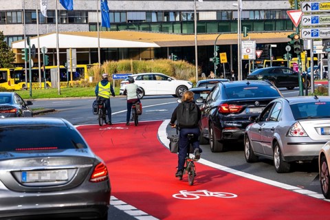 Cycle path, cycle lane, marked in red to draw the attention of motorists to the cycle path, between
