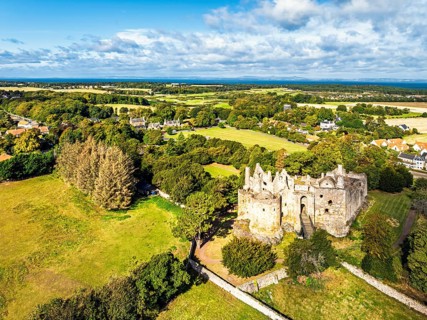 Ruins of Dirleton Castle & Gardens from a drone, Dirleton, East Lothian, Scotland, UK