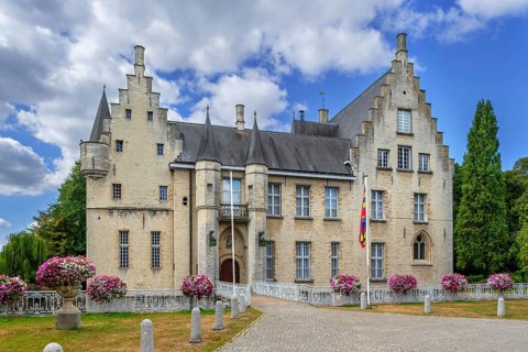 Kasteel Cortewalle, 15th century moated castle in Flemish Renaissance style at Beveren in summer,