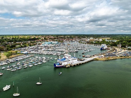 Wight Light car ferry to Isle of Wight on Lymington River and marina from drone, Lymington, New