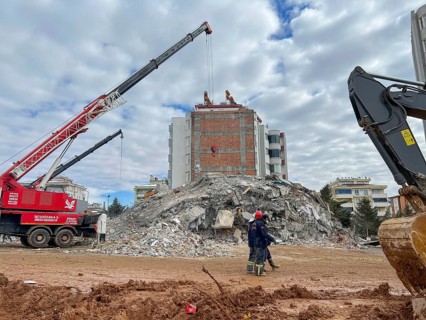 Turkish civil defense teams (AFAD) search for survivors under the rubble after a powerful 7