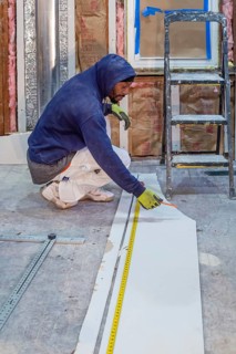 Detroit, Michigan - Workers remodel a house in the Morningside neighborhood that had been vacant