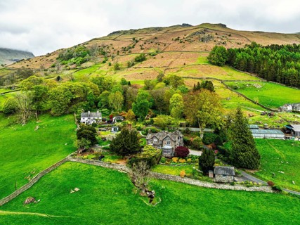 Farms and Mountains over road A591 from a drone, Grasmere Lake, Grasmere, Ambleside, Lake District,
