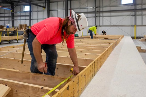 Romulus, Michigan - Workers build apartments in Ginosko Modular 's factory using modular