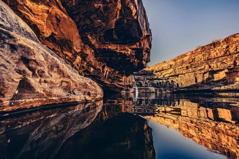 Bell Gorge waterfall, a body of water in north-west Australia in the Kimberley. Sunrise in the