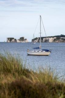 Boats on sea over Knoll Beach Studland, Poole, Dorset, England, United Kingdom
