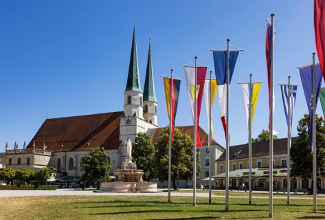 National flags at Kapellplatz with the collegiate parish church of St Philip and St James, place of