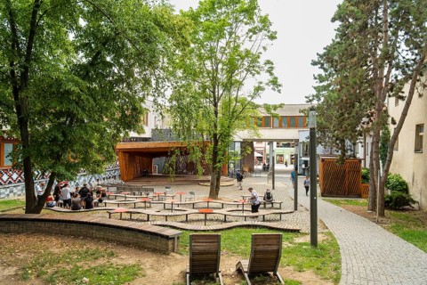 Small park with seating, a playground and a fountain at the entrance to Trencin Castle, Capital of