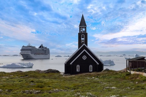 Typical architecture of Greenland Ilulissat with colored houses located near fjords and icebergs