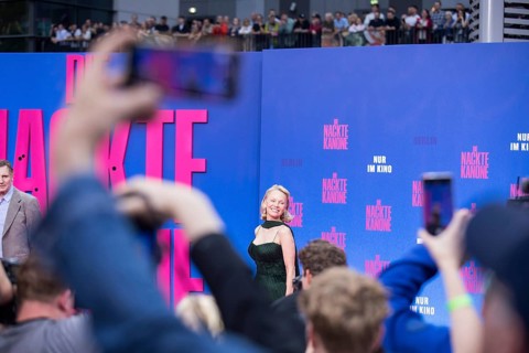 Pamela Anderson between fans at the film premiere of The Naked Gun at UCI Luxe East Side Gallery,