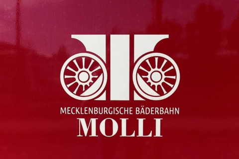 Mecklenburgische Bäderbahn Molli, logo on carriage, Baltic resort Kühlungsborn, Baltic Sea,