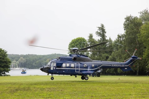 A helicopter with Emmanuel Macron (President of the French Republic) on board in front of a joint