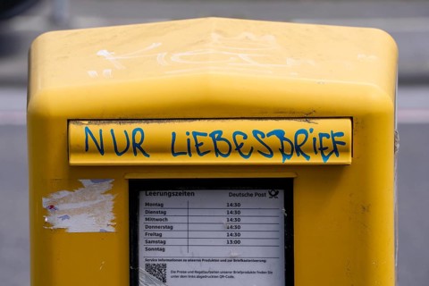 Deutsche Post letterbox, with stickers and graffiti, labelled Only love letters, Leverkusen, North