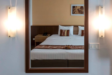 Symbol photo hotel room mirror bed