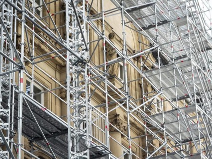Scaffolded façade of the district court with metal platforms and stairs in Wuppertal, Germany