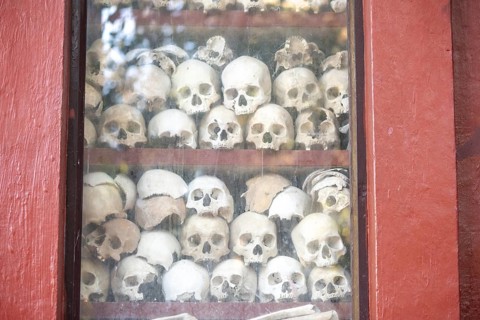 Shrine with human skull, memorial to the victims of the Khmer Rouge regime, Wat Thmei, Siem Reap,