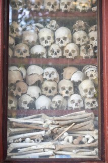 Shrine with human skull, memorial to the victims of the Khmer Rouge regime, Wat Thmei, Siem Reap,
