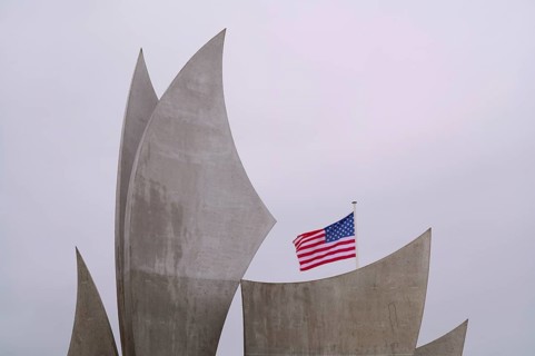 US flag, flag of the USA over Les Braves, memorial of Anilore Banon, polynational memorial to the