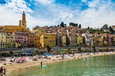Town with colourful houses by the sea, Plage des Sablettes, Menton, Alpes Maritimes, Provence Alpes