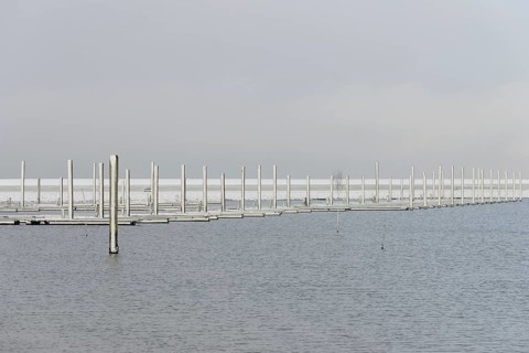 Winter day, onset of winter, snow on the jetties in the marina, North Sea, Norddeich, Lower Saxony,