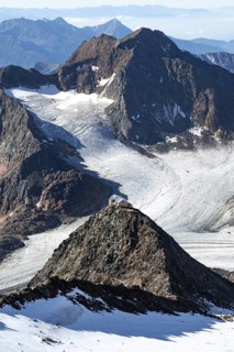 At the Wilder Freiger summit, picturesque high mountain landscape with snow, view of the