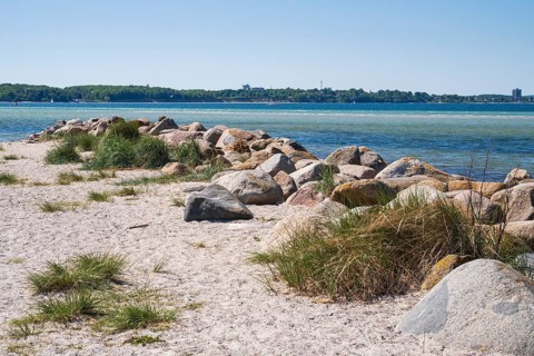 Large stones as a boundary on the sandy beach, Laboe, Baltic resort, Fjord, Baltic Sea, North