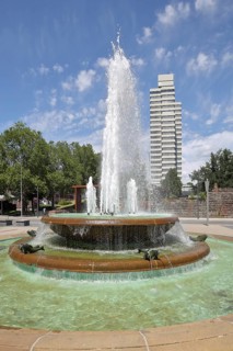 Round torch fountain by Friedrich Korter 1939 and town hall, water fountain with water basin, water