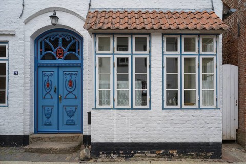 Beautiful ornate door mullion window, facade, old town, Husum, North Frisia, Schleswig-Holstein,