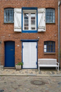 Window with shutters, brick façade, warehouse building, old town centre, Husum, North Frisia,