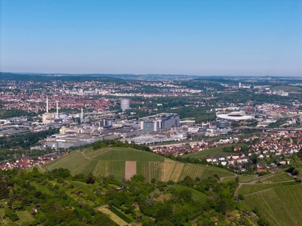 City panorama of Stuttgart with hills and vineyards, in the background the Mercedes-Benz plant in