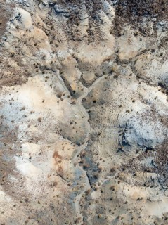 Broken, rocky ground with sparse vegetation. Aerial view. Drone shot. Southern Namibia