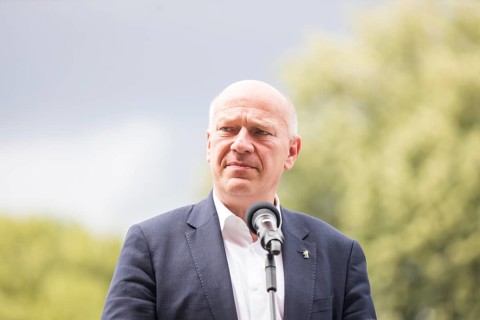 Kai Wegner (Governing Mayor of Berlin) gives a speech in front of the raising of the rainbow flag