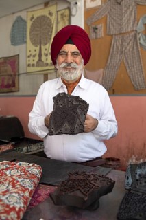 Indian Sikh, 68 years old, showing a wooden panel for woodblock printing, Jaipur, Rajasthan, India