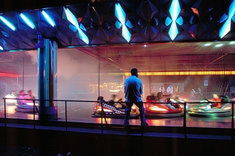 Illuminated bumper cars at night, New Jersey, USA