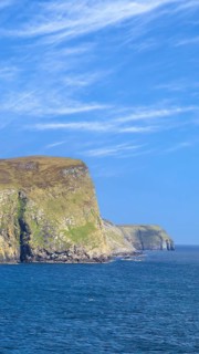 Scotland Shetland scenery in England with cliffs, ocean views and green pastures