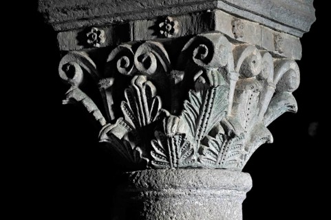 Column capitals with plants, flora, relief in stone, underground grove of columns, pagan crypt,