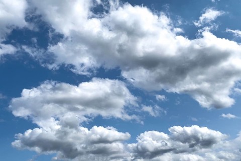 White clouds Altocumulus in front of blue sky. international