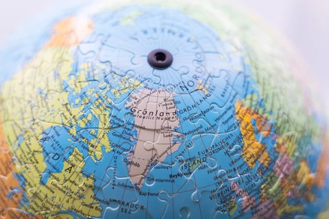 Puzzle globe. Map made from puzzle pieces. Greenland and Denmark