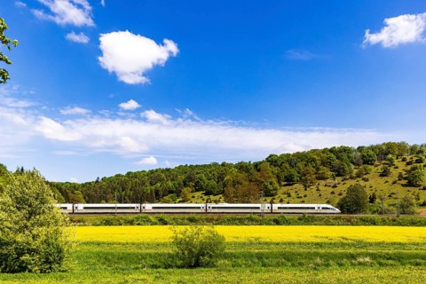 InterCityExpress ICE en route on the Swabian Alb near Lonsee. Landscape on the railway's