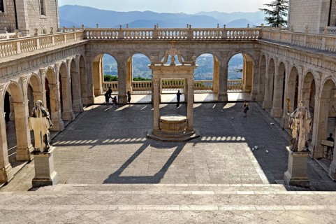 Bramante cloister with cistern and statues of St Benedict and St Scholastica of Nursia, Benedictine