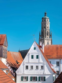 View from the medieval town wall over the houses of the historic old town to the tower of St