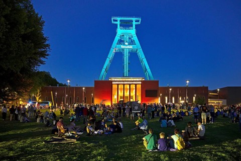 People in front of the German Mining Museum for the Extra Shift at night, Bochum, Ruhr Area, North