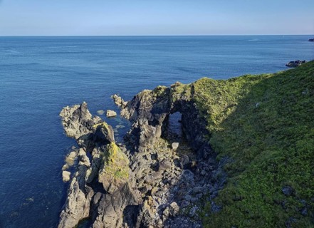 Rocky coast and rock gate on the south-east coast near the southern tip of Cornwall on the English