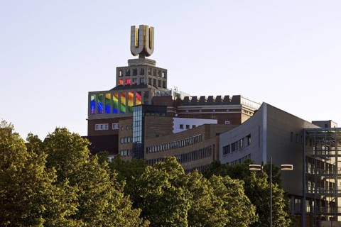 Dortmunder U, Flying pictures by Adolf Winkelmann with green trees, Dortmund, Germany