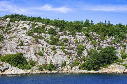 Wooded coastal landscape of granite rocks in the archipelago near Lysekil, Bohuslän, Västra