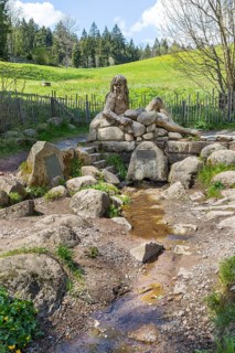 Figure of the river god Danuvius by sculptor Wolfgang Eckert at the source of the Breg, source of