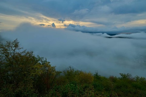 Foggy landscape with clouds and trees under a colourful morning sky, summer, Rhine bend Boppard,